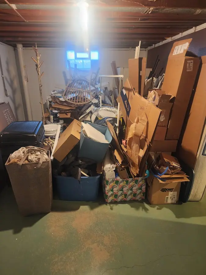 Roll-off dumpster container at job site for Concrete Dumpster Rental in Wells